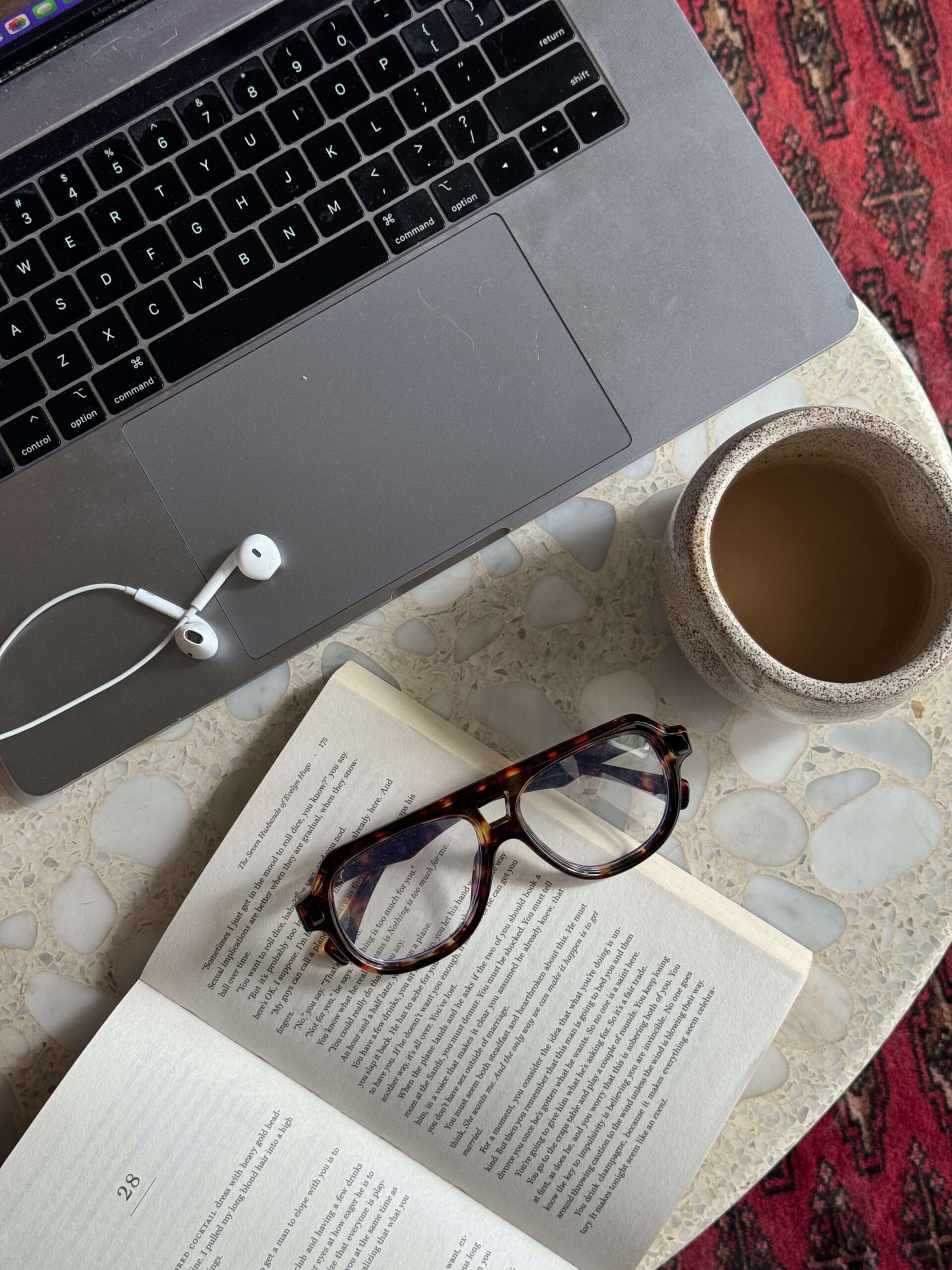 glasses, coffee, and computer on a desk